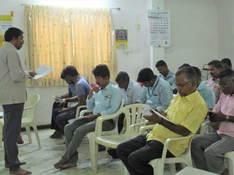 Group of adult Indian men in training session for blog on Energy Efficiency in India