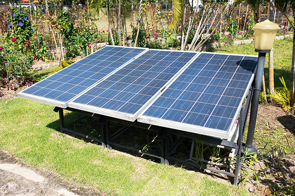 solar panels installed in a garden for residential use